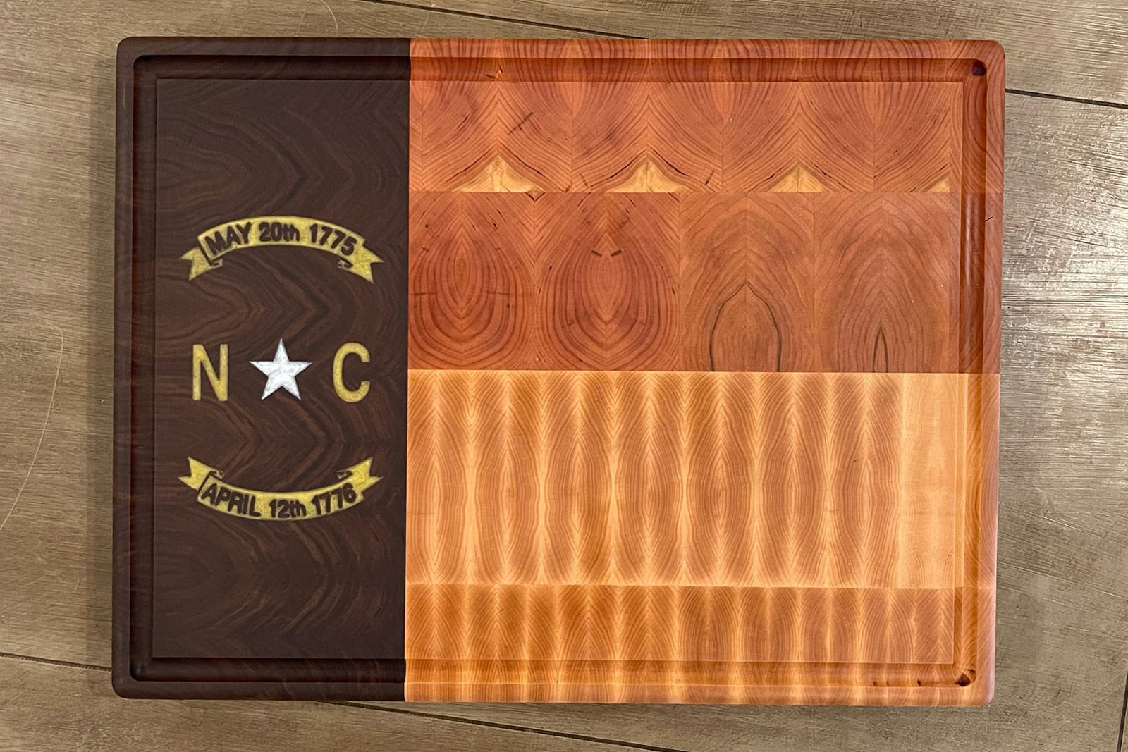 RoseWood Block & Co custom North Carolina flag cutting boards. North Carolina wood Cutting blocks handmade in the USA. Custom North Carolina cutting board. NC flag wood cutting block