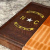 RoseWood Block & Co custom North Carolina flag cutting boards. North Carolina wood Cutting blocks handmade in the USA. Custom North Carolina cutting board. NC flag wood cutting block