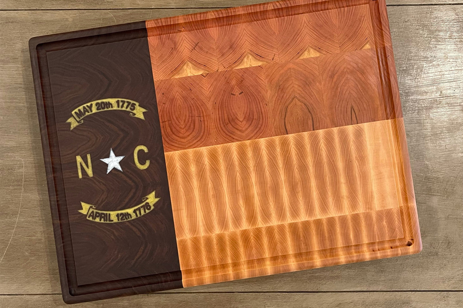 RoseWood Block & Co custom North Carolina flag cutting boards. North Carolina wood Cutting blocks handmade in the USA. Custom North Carolina cutting board. NC flag wood cutting block